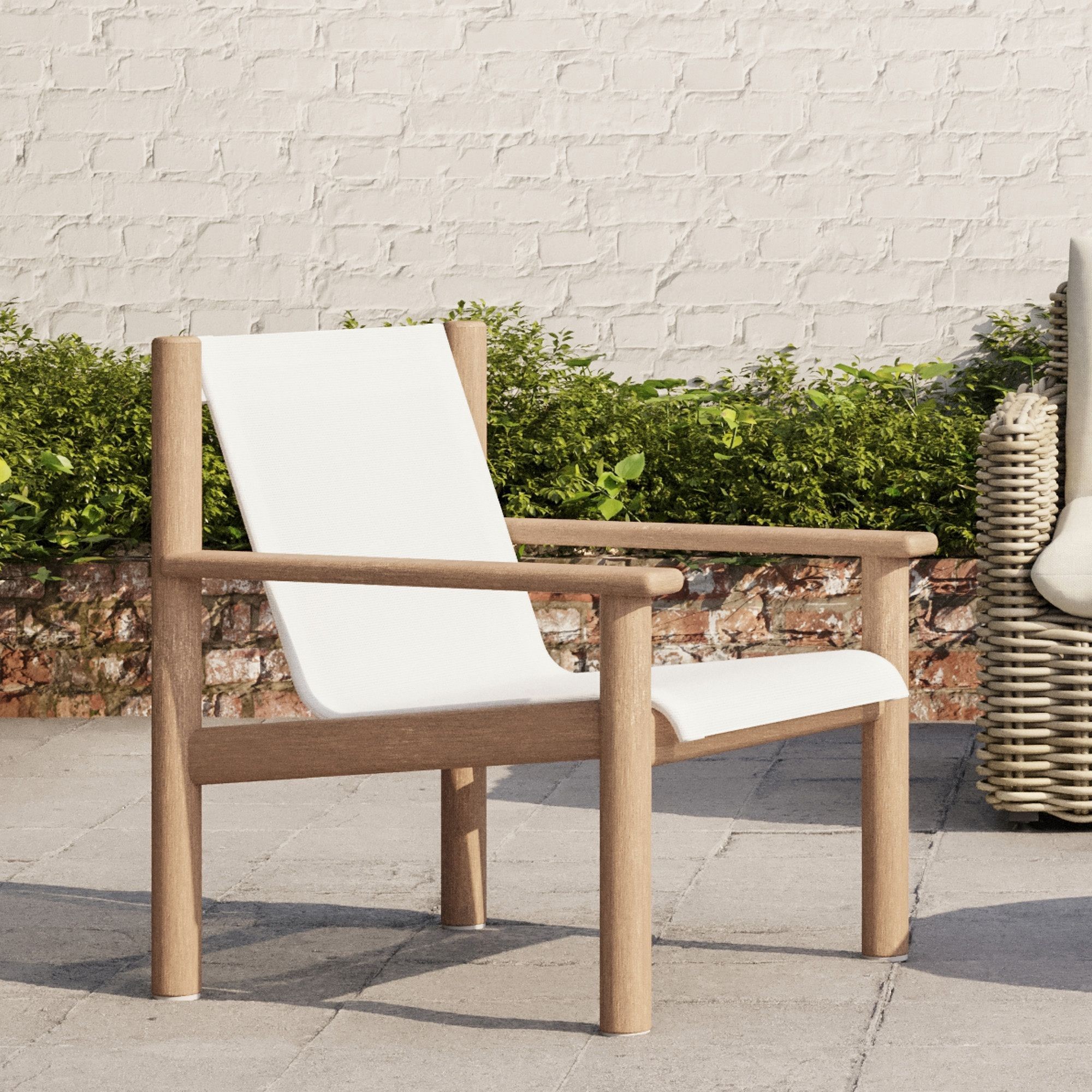 West Elm Cusco Outdoor Textilene Sling Chair folded on patio