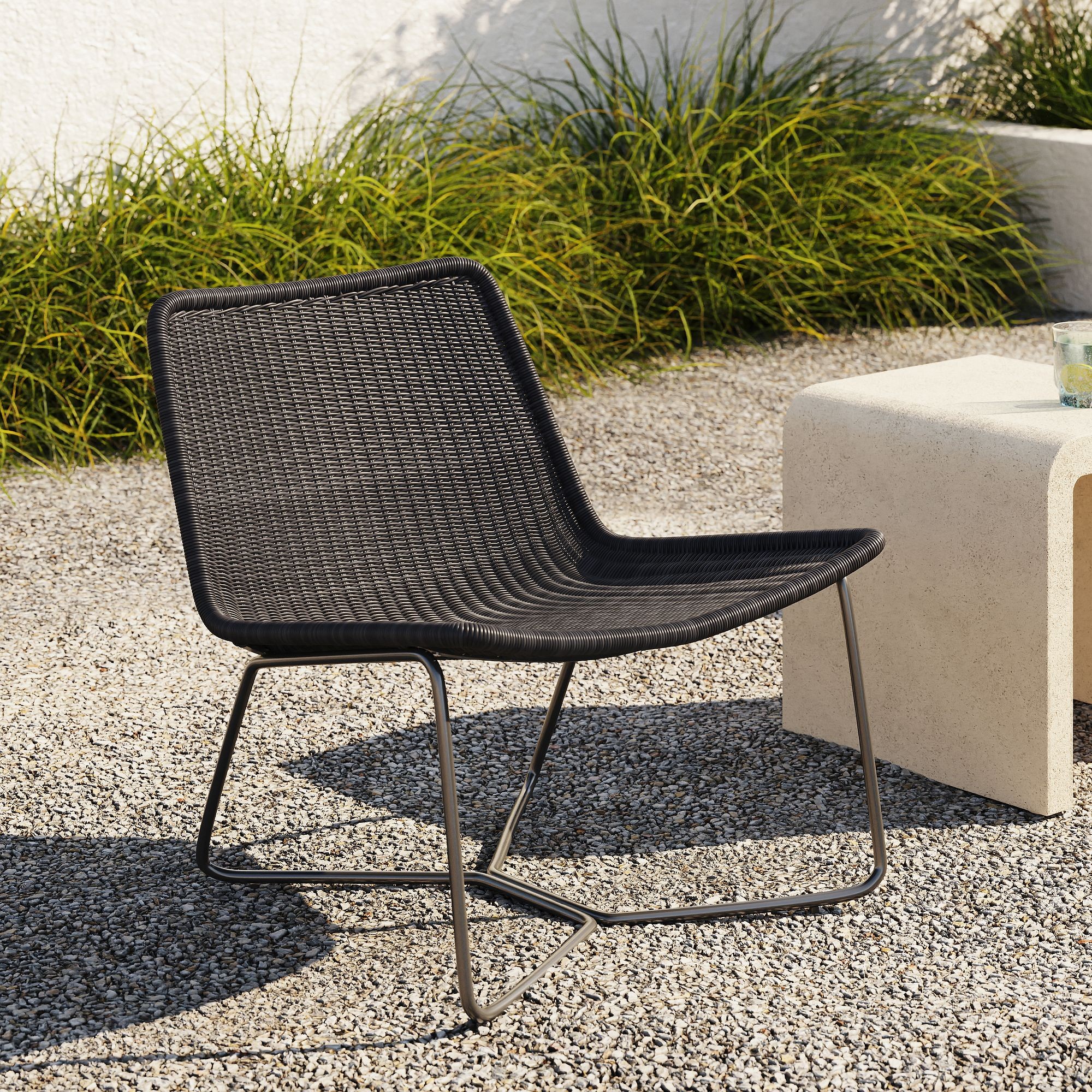 West Elm Outdoor Slope Lounge Chair on patio