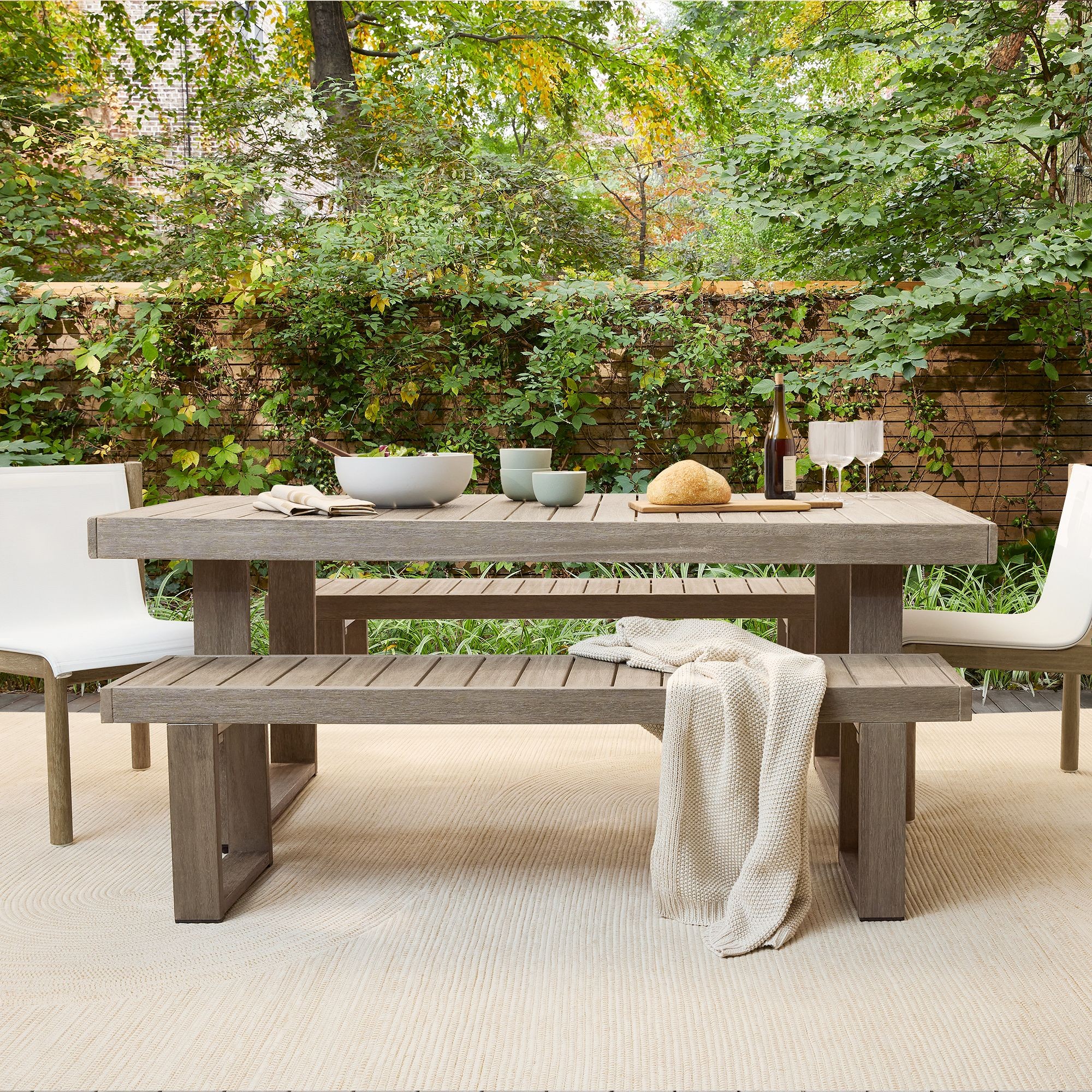 West Elm Portside Outdoor Dining Table in teak-look acacia
